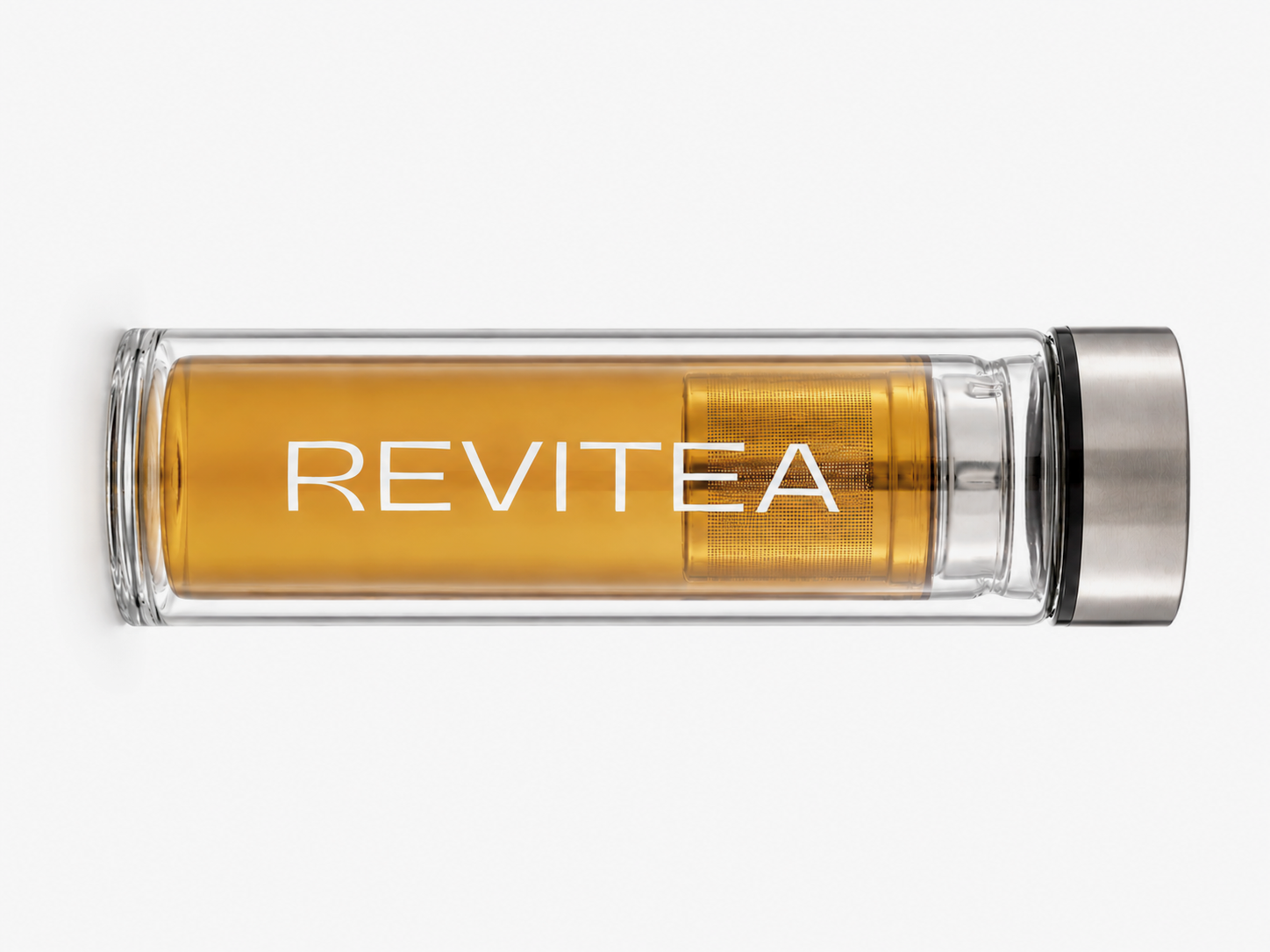 Clear glass tumbler with metal lid filled with Revitea tea on a white background